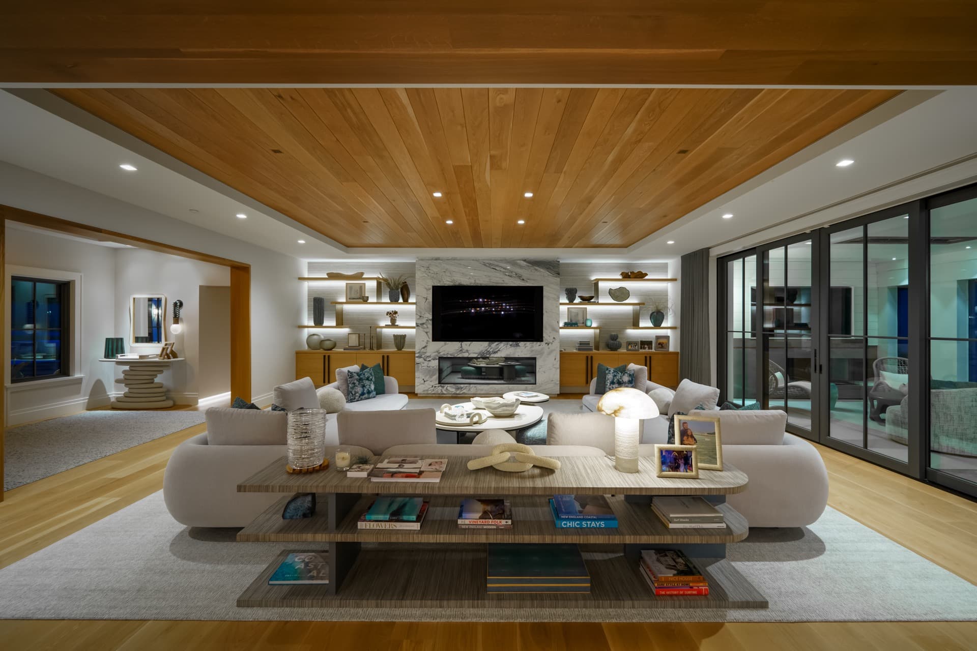 Family room with layered cove, shelf, and recessed lighting